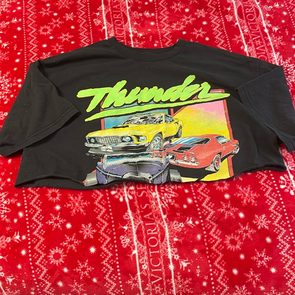 Selling cropped Brandy Melville “thunder” shirt color is black and it’s one size